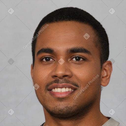 Joyful black young-adult male with short  black hair and brown eyes