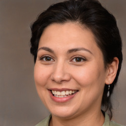 Joyful white adult female with medium  brown hair and brown eyes