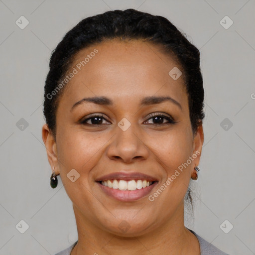 Joyful latino young-adult female with short  black hair and brown eyes