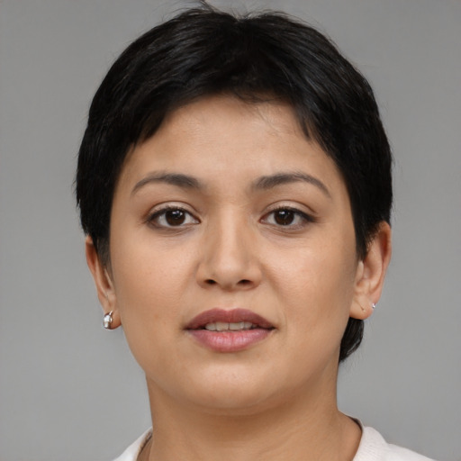 Joyful asian young-adult female with short  brown hair and brown eyes