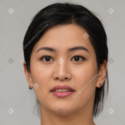 Joyful asian young-adult female with medium  black hair and brown eyes