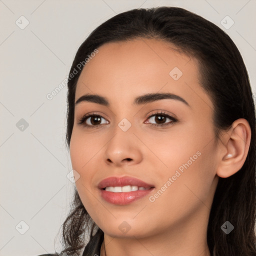 Joyful white young-adult female with long  black hair and brown eyes