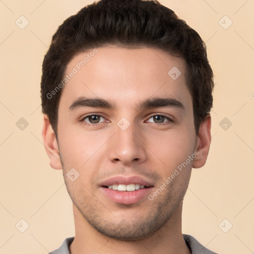 Joyful white young-adult male with short  brown hair and brown eyes