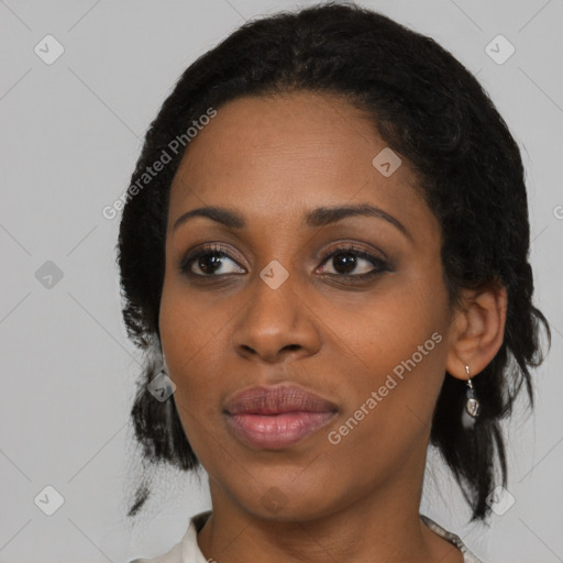 Joyful black young-adult female with medium  black hair and brown eyes