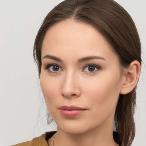 Neutral white young-adult female with long  brown hair and brown eyes