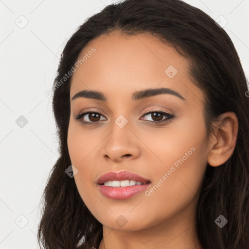 Joyful latino young-adult female with long  black hair and brown eyes