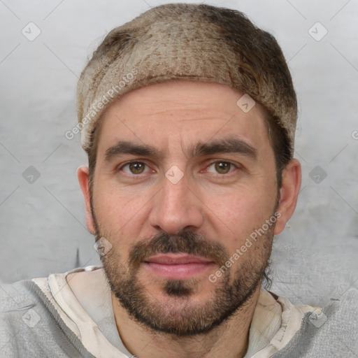 Joyful white adult male with short  brown hair and brown eyes