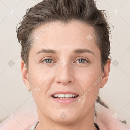 Joyful white young-adult female with short  brown hair and grey eyes