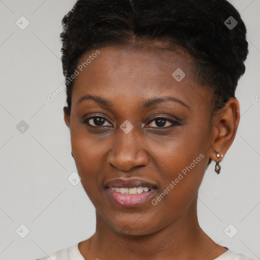 Joyful black young-adult female with short  brown hair and brown eyes