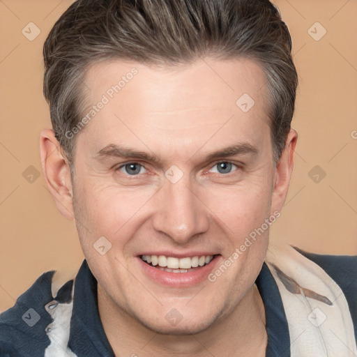 Joyful white adult male with medium  brown hair and brown eyes