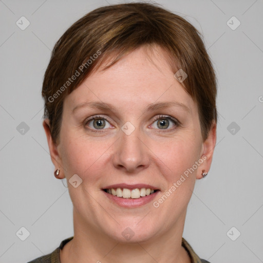 Joyful white young-adult female with short  brown hair and grey eyes