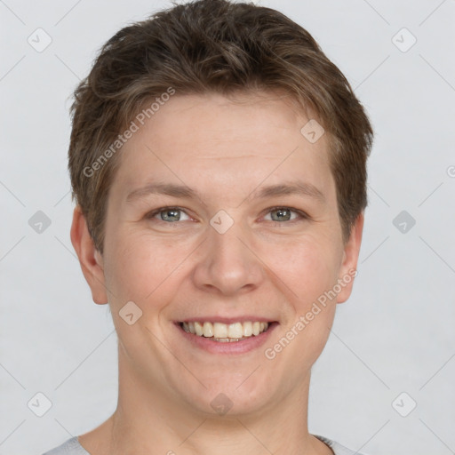 Joyful white young-adult female with short  brown hair and grey eyes