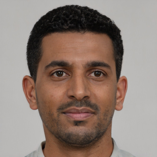 Neutral black young-adult male with short  black hair and brown eyes