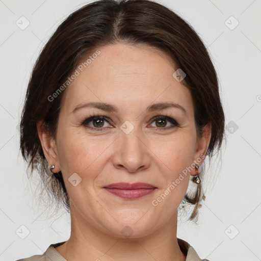 Joyful white adult female with medium  brown hair and grey eyes