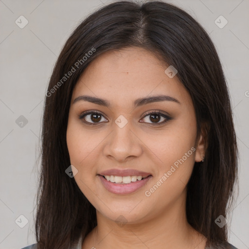 Joyful latino young-adult female with long  brown hair and brown eyes