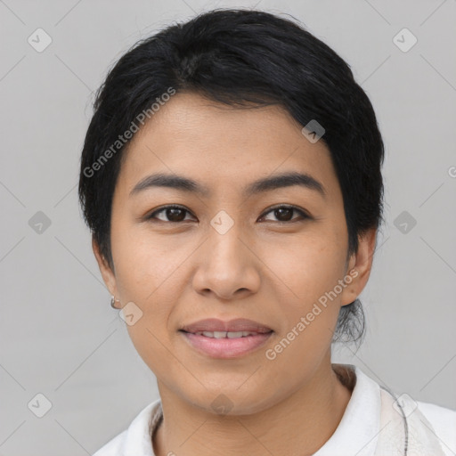 Joyful asian young-adult female with short  black hair and brown eyes