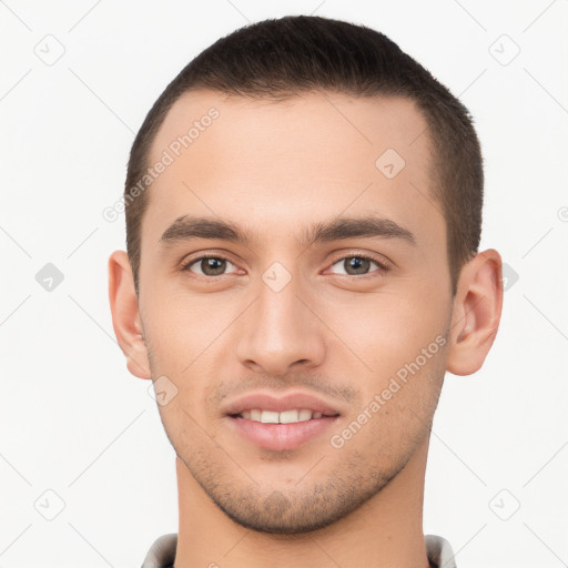 Joyful white young-adult male with short  brown hair and brown eyes