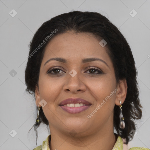 Joyful latino adult female with medium  brown hair and brown eyes