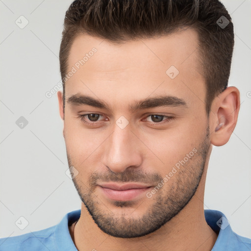 Joyful white young-adult male with short  brown hair and brown eyes