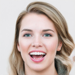 Joyful white young-adult female with medium  brown hair and green eyes