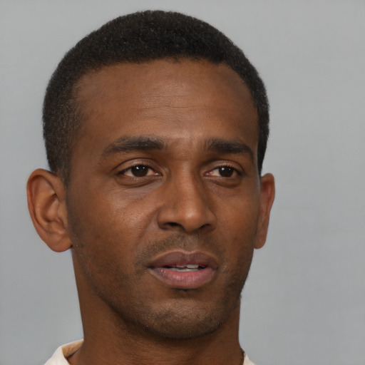 Neutral black young-adult male with short  brown hair and brown eyes