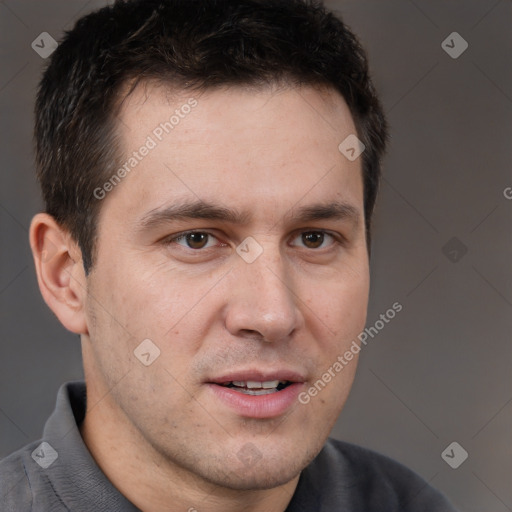 Joyful white adult male with short  brown hair and brown eyes