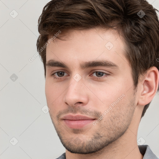 Neutral white young-adult male with short  brown hair and brown eyes