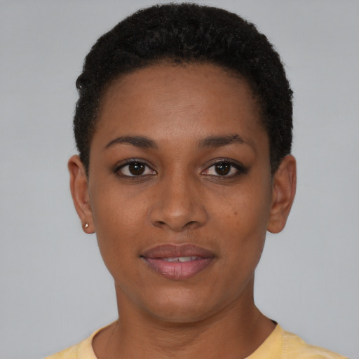 Joyful black young-adult female with short  brown hair and brown eyes