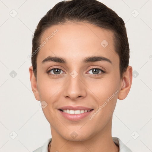 Joyful white young-adult female with short  brown hair and brown eyes