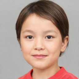 Joyful white child female with short  brown hair and brown eyes