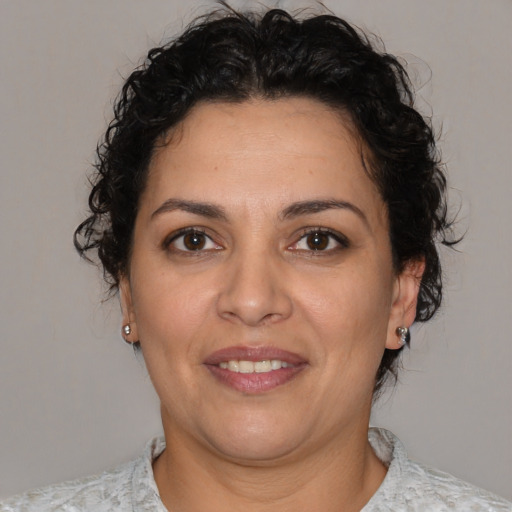 Joyful white adult female with short  brown hair and brown eyes