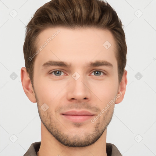 Joyful white young-adult male with short  brown hair and grey eyes