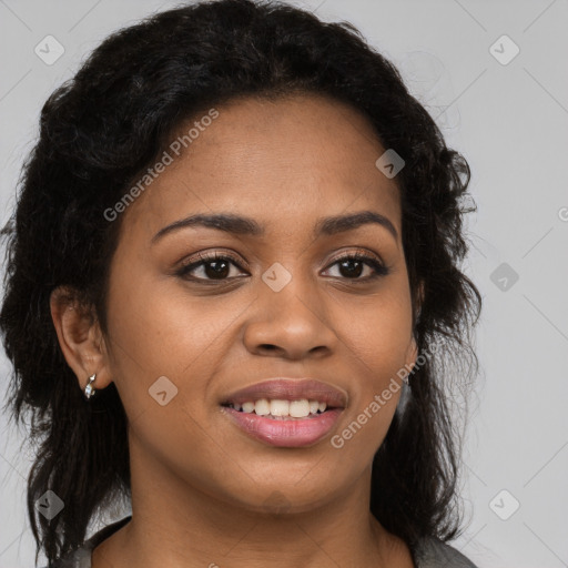 Joyful black young-adult female with long  brown hair and brown eyes