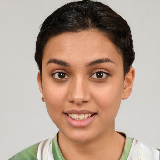 Joyful white young-adult female with short  brown hair and brown eyes