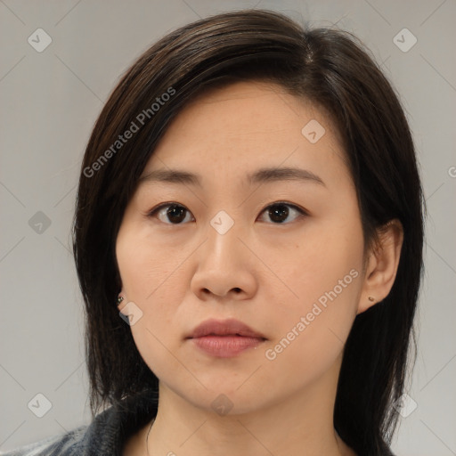 Neutral asian young-adult female with medium  brown hair and brown eyes