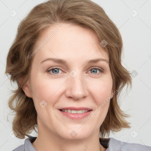 Joyful white young-adult female with medium  brown hair and blue eyes