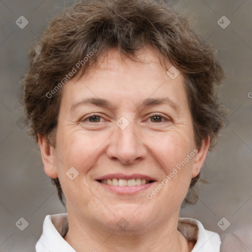 Joyful white adult female with short  brown hair and brown eyes