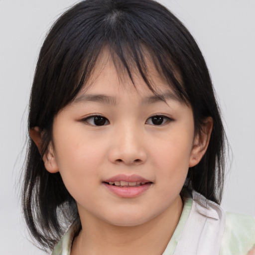 Joyful asian child female with medium  brown hair and brown eyes