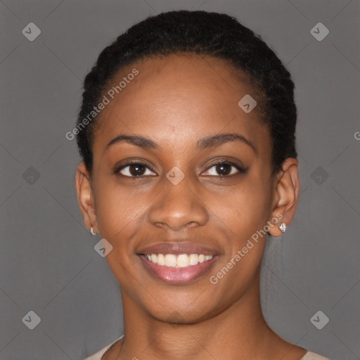 Joyful black young-adult female with short  black hair and brown eyes