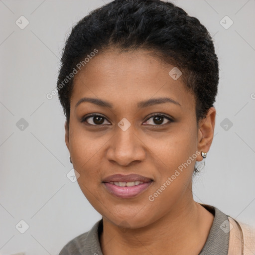 Joyful black young-adult female with short  black hair and brown eyes