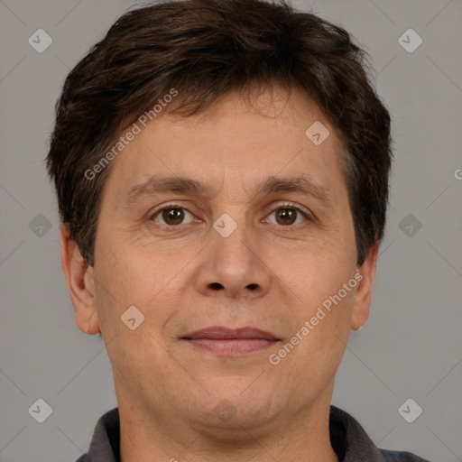 Joyful white adult male with short  brown hair and brown eyes