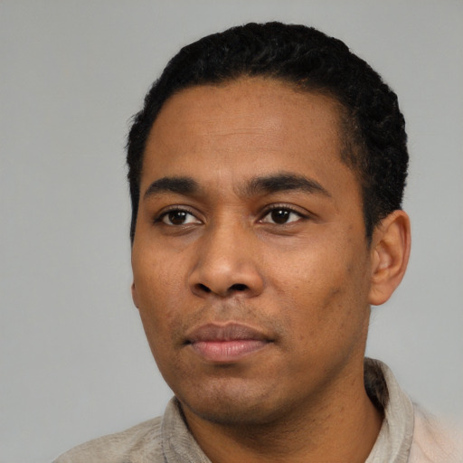 Neutral latino young-adult male with short  black hair and brown eyes