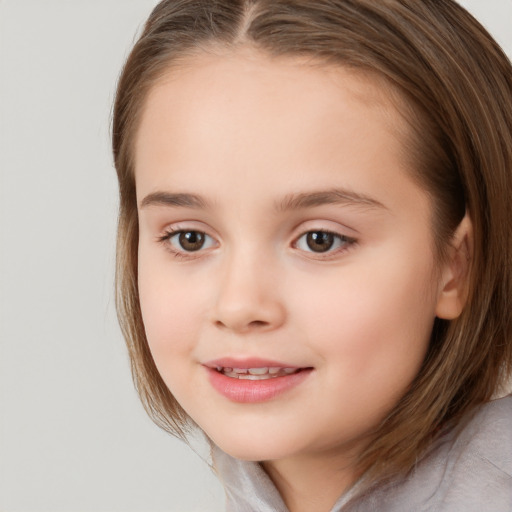 Joyful white child female with medium  brown hair and brown eyes