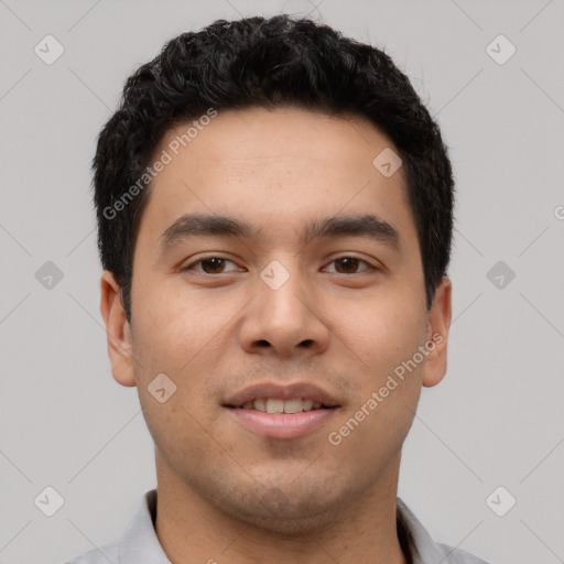 Joyful latino young-adult male with short  black hair and brown eyes