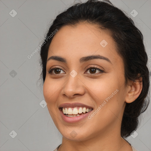 Joyful latino young-adult female with long  black hair and brown eyes