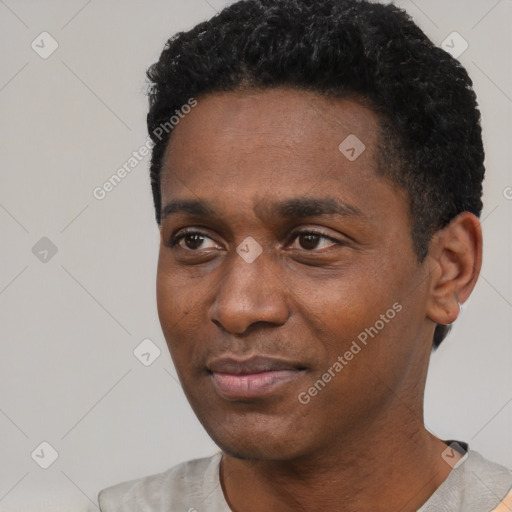 Neutral black young-adult male with short  black hair and brown eyes