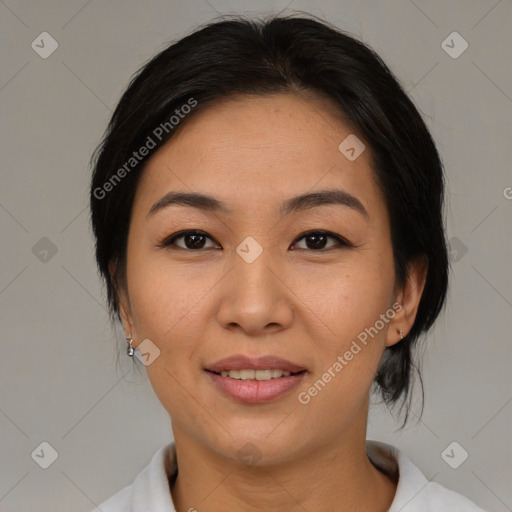 Joyful asian young-adult female with medium  black hair and brown eyes