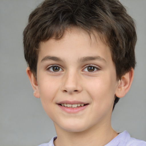 Joyful white child male with short  brown hair and brown eyes