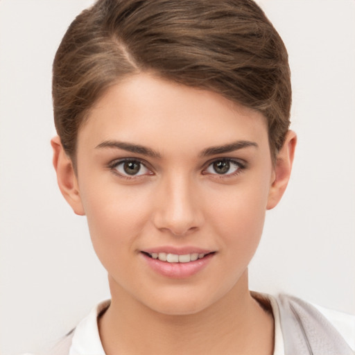 Joyful white young-adult female with short  brown hair and brown eyes