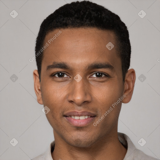 Joyful black young-adult male with short  black hair and brown eyes